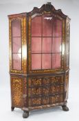 A 19th century Dutch walnut and marquetry display cabinet, with single glazed door enclosing two