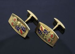 A pair of 18ct gold tonneau shaped cufflinks with two-colour enamel family crest appliques,, gross