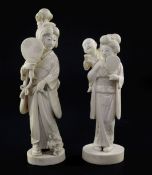 Two Japanese ivory groups of bijin, early 20th century, the first of a lady holding a fan and