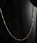 An 18ct gold and platinum trace and bar link chain necklace, 24.5in, 30.5 grams.