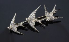 A gold and diamond set triple swallow brooch, set with old cut diamonds, 2.5in.