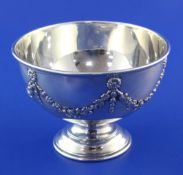 A George V silver circular pedestal bowl, decorated with harebells and swags, William Devonport?,