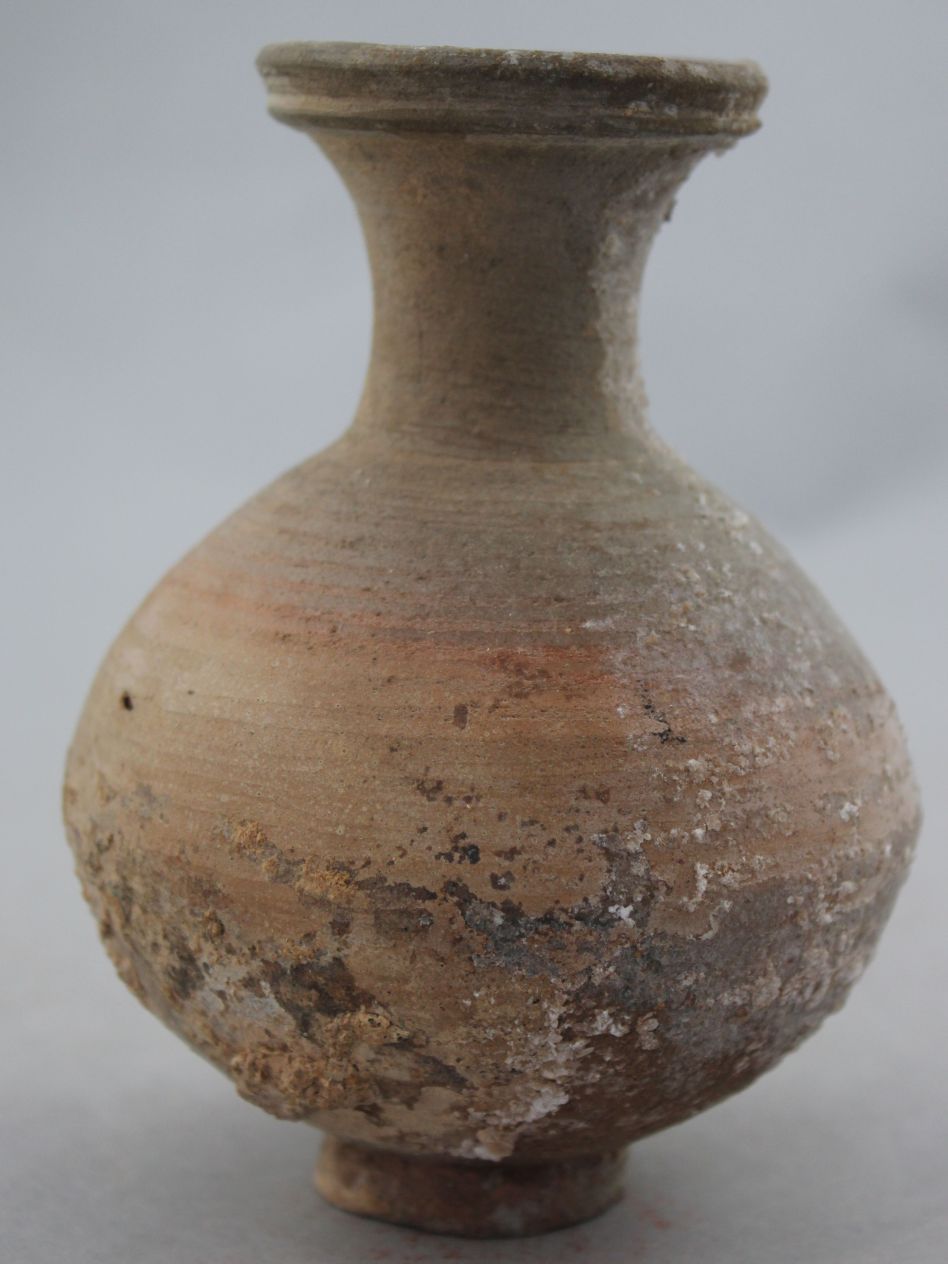 A Greek pottery vase, c.3rd century B.C., of globular form with a trumpet neck, 13cm