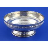 A George V Omar Ramsden silver bowl, the planished body with engraved inscription and applied