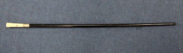 A late Victorian ebonised walking cane, with embossed silver ferrule and a shibayama inlaid ivory