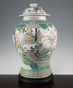 A large Chinese famille rose baluster jar and cover, 20th century, painted with immortals amid