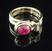 A 1950's/1960's? French 18ct gold ruby and diamond ring, set with oval cabochon ruby and two round