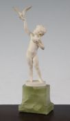 Ferdinand Preiss (German, 1882-1943). An Art Deco carved ivory figure of a young girl feeding a