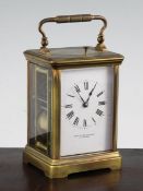 An Edwardian ormolu hour repeating carriage clock, with enamelled dial signed Hamilton & Inches, and