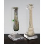 Two Roman glass unguentarium, c, 2nd century A.D., both with mineral iridescence, one with double