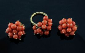 A pair of 18ct gold and coral cluster earrings and a similar dress ring with unmarked gold double