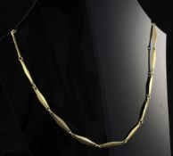 A stylish French 18ct gold necklace, with pierced diamond shaped links, 16.9 grams, 15in.