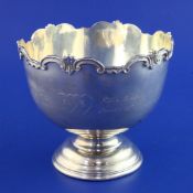 A 1930's silver presentation pedestal rose bowl, with engraved inscription and scroll border,