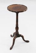 A George III mahogany tripod wine table, with circular dished top, on baluster turned column with