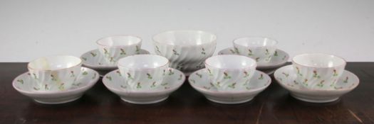 A Newhall part tea set, c.1795, each piece spiral fluted and painted with iron red and green