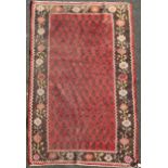 An Armenian rug from the Ngorno Karabakh region, with field of stylised pears on a madder ground,