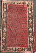 An Armenian rug from the Ngorno Karabakh region, with field of stylised pears on a madder ground,