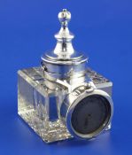 A George V silver mounted combination glass inkwell, pocket watch and barometer holder, of square