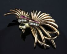 A continental 14ct gold, diamond and synthetic ruby set brooch, modelled as a bird on a branch