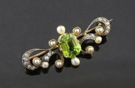 A late Victorian gold, peridot, diamond and split pearl set bar brooch, of scrolling design, 1.5in.