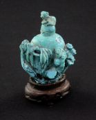 A Chinese turquoise matrix snuff bottle, late 19th / early 20th century, carved in high relief