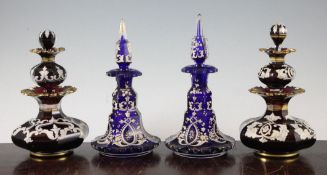 A pair of unusual Bohemian ruby glass 'double' scent bottles, late 19th century, of squat baluster