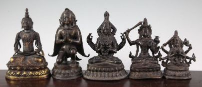 Five Sino-Tibetan bronze figures of Buddhist deities, including the winged Garuda and Majushri,