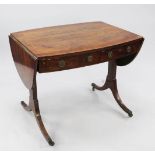 An early 19th century oval crossbanded mahogany sofa table, with single drawer and dummy drawer