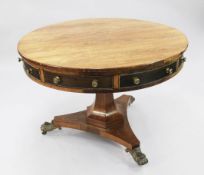 A 19th century circular rosewood drum table, stamped Gregory & Co, Regent Street, London, fitted
