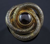 A Victorian 14ct gold and garnet brooch, of scrolling design, with free form ropetwist decoration