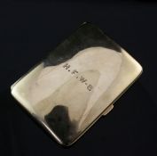 A George V 9ct gold cigarette case by Asprey & Co Ltd, of concave form, with engraved initials,