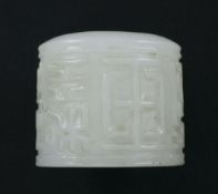A Chinese white jade archer's thumb ring, 20th century, carved in high relief with characters, 3.
