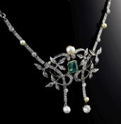 An Edwardian platinum and 18ct gold, emerald, diamond and pearl drop necklace, of scrolling