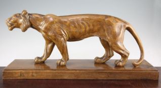 A French Art Deco carved wood model of a standing lioness, on rectangular plinth base, inscribed