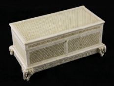 An Indian ivory pierced casket, early 20th century, the hinged cover and side panels pierced with