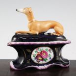 A rare Staffordshire 'greyhound' ink stand and cover, mid 19th century, the cover modelled as a