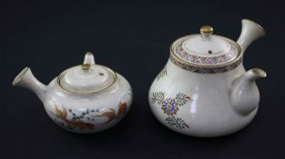 Two Japanese Satsuma pottery wine pots and covers, Meiji period, made for the Home market, the