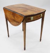 A George III oval mahogany and satinwood crossbanded Pembroke table, with single end drawer, on