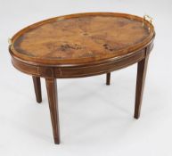 A George III oval two handled tray, the top with boxwood and satinwood central fan shaped motif,
