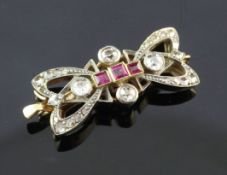 An Edwardian Belle Epoque gold, ruby and diamond set necklace clasp, of ribbon bow form, 1.25in