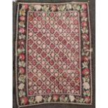 An Armenian rug from the Ngorno Karabakh region, with trellised field of stylised botehs, on a