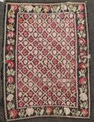 An Armenian rug from the Ngorno Karabakh region, with trellised field of stylised botehs, on a