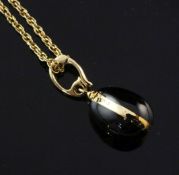 A Victor Mayer for Faberge 18ct gold, black onyx and diamond set egg pendant on 9ct gold chain, no.