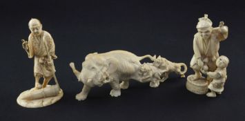 Three Japanese ivory groups, late 19th / early 20th century. the first an elephant being attacked by