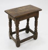 A 17th century oak joynt stool, with baluster turned legs united by stretchers, W.1ft 6.5in.