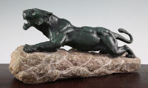 Richard Fath. A French Art Deco patinated bronze model of a crouching panther, on a naturalistic