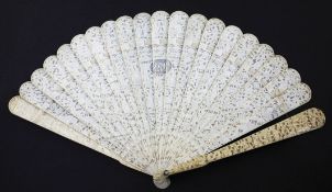 A Chinese export ivory brise fan, 19th century, the guards and sticks carved in relief with