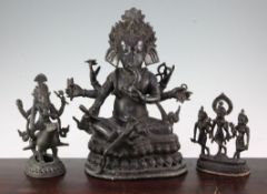 Three bronze Hindu groups, two depicting a multi-armed Ganesh and the third Krishna and two