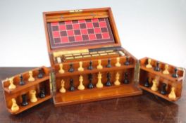 A late Victorian mahogany cased games compendium, by F.H. Ayres, with ebony and boxwood chess