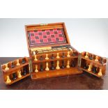 A late Victorian mahogany cased games compendium, by F.H. Ayres, with ebony and boxwood chess